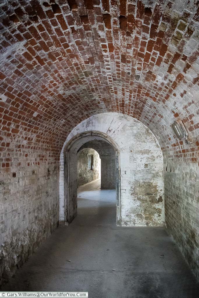 The brick-built tunnels, with regular doorways, that sit under Upnor Castle