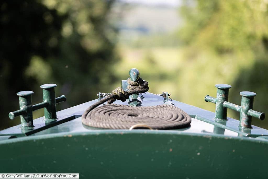 The neatly coiled mooring rope at the bow, or front, of the boat.