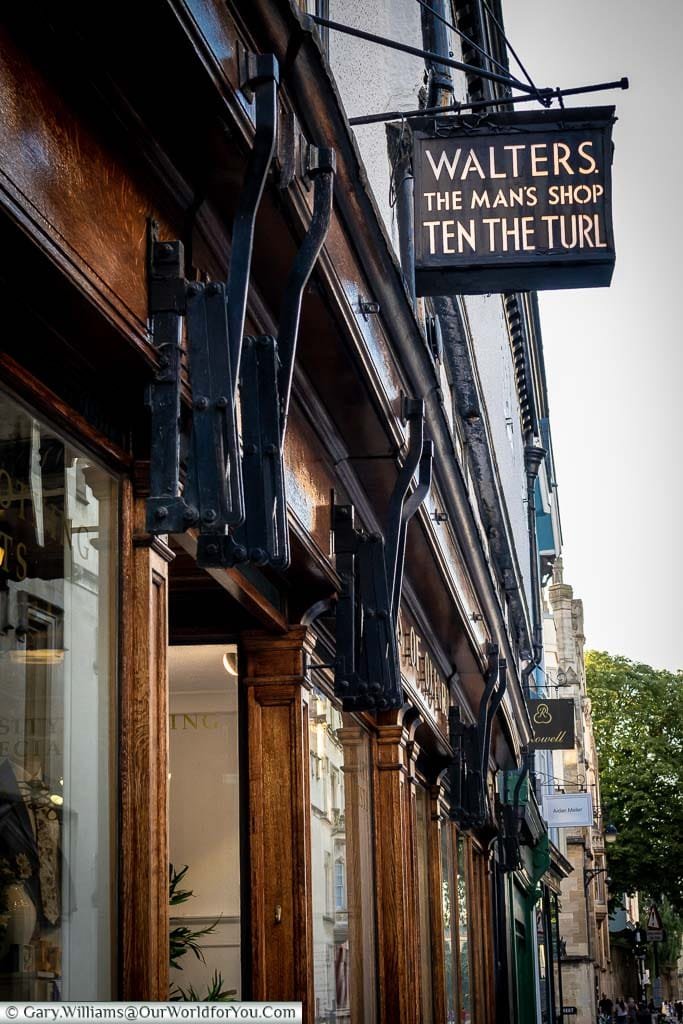 A sign above a shop for Walters of Oxford, a traditional gentleman's outfitters, on Turl Street, Oxford