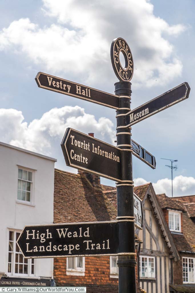 A street sign pointing out all the places of interest in Cranbrook including the museum, vestry Hall and the tourist Information Centre.