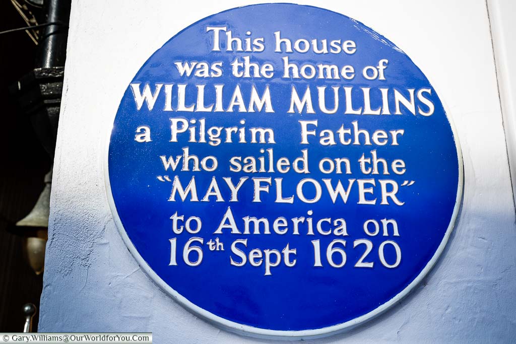 An enamelled blue plaque to William Mullins, a Pilgrim Father who sailed on the Mayflower, on West Street in Dorking.