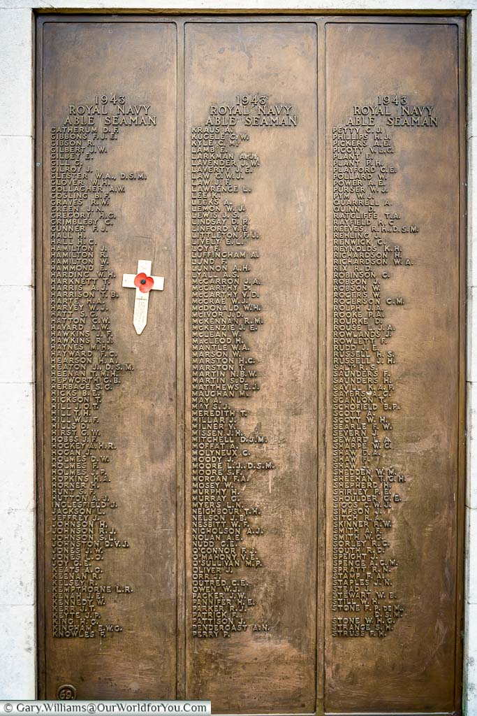 A closer view of one of the brass plaques attached to the outer arms of the Chatham Naval Memorial detailing around 150 of those who fell in battle