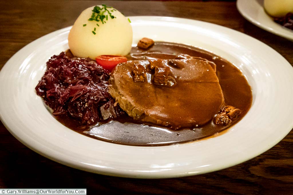 A plate of typical German food at the Zum Goldenen Einhorn just opposite the Rathaus. This Aachen Sauerbraten has a local twist with the sauce including the gingerbread the city is known for.