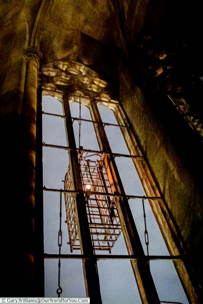 Focusing on one of the Anabaptist cages inside the bell tower of St. Lamberti Church at night. The only light is a single bulb in the cage and a little moonlight.