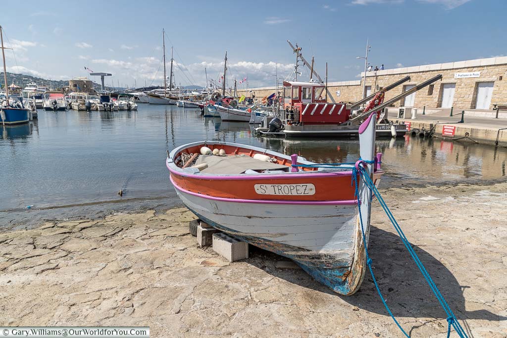 An old wooden fishing boat moored up the harbour of Saint Tropez on the French Riviera