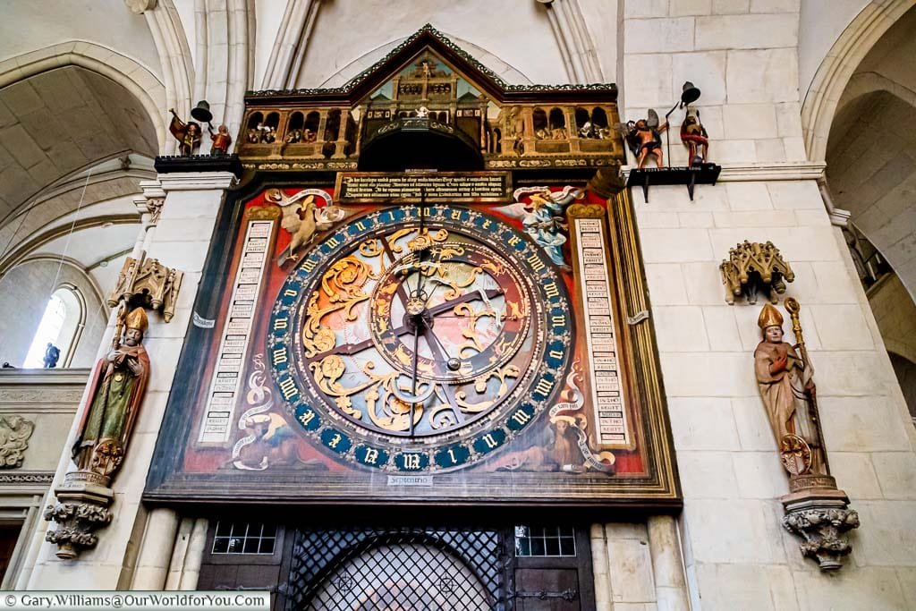 A close-up of the top two-thirds of the Astronomical Clock. The top section contains the automated section with the depiction of the adoration of the magi. The centre section includes the astronomical clock with the time, lunar & planetary phases in a beautiful ornate design.