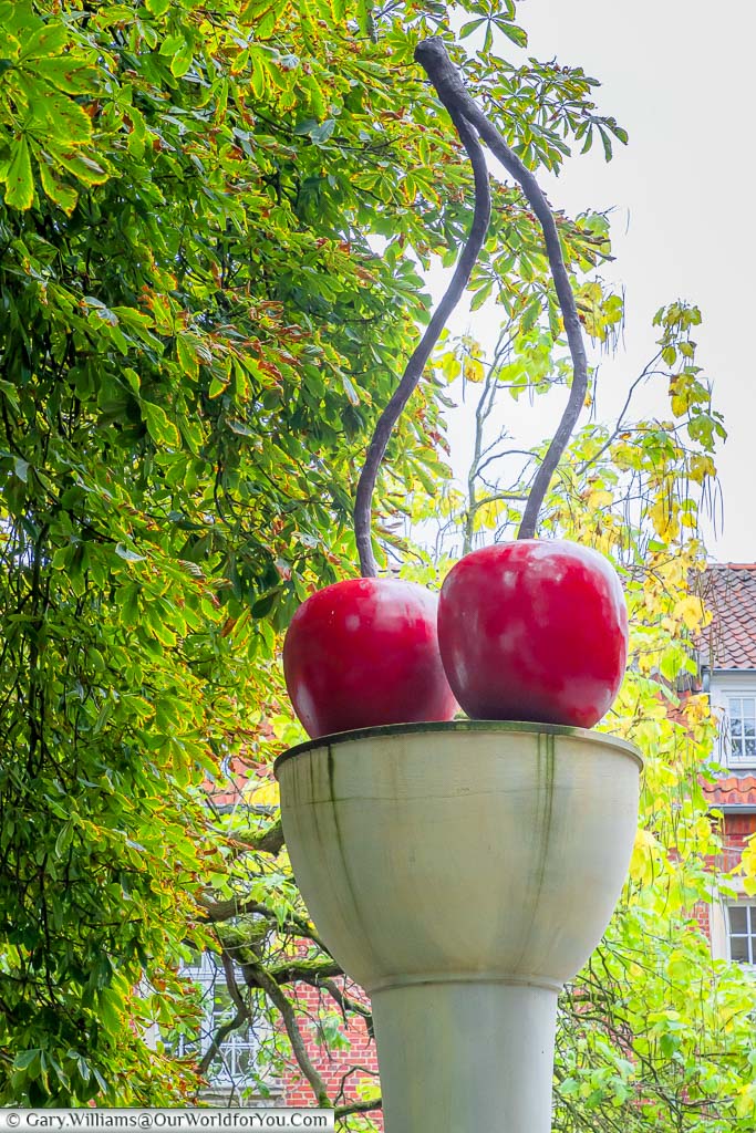 An art instaltion of two cherries on a column by Thomas Schütte. One of the many pieces of public art in the city.