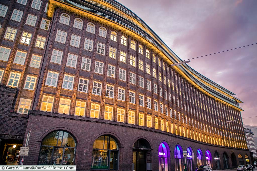 The beautiful curves of the brick-built, Chilehaus office building, From the 1920s at dusk. this beautiful complex is another side to Hamburg.