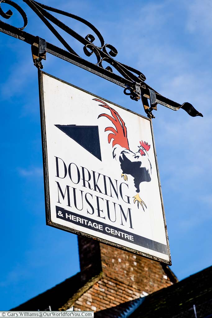 The Dorking Museum & Heritage Centre hanging sign above the building on West Street.