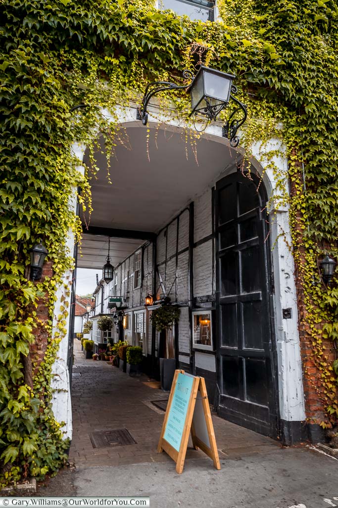 Through the ivy-covered archway to the entrance courtyard of the Talbot Inn.