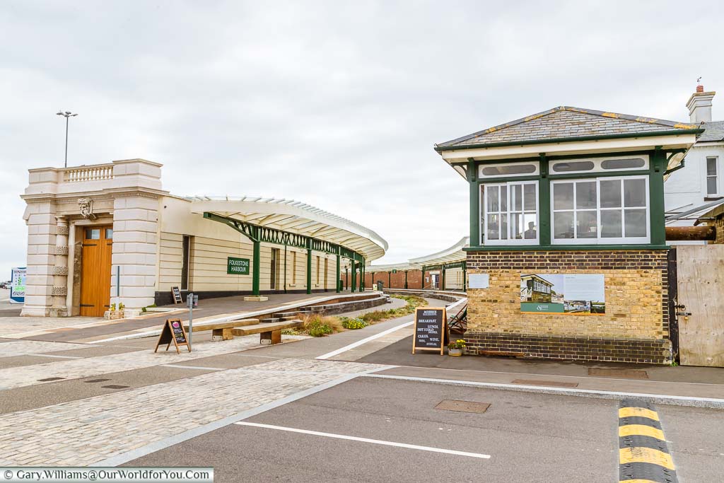The old Folkestone Harbour station, signal box and Customs House. Freshly pained and repurposed as an entrance to the Harbour Arm with bars and restaurants. The centre of the tracks has now been replanted with a garden, but many of the original features remain.