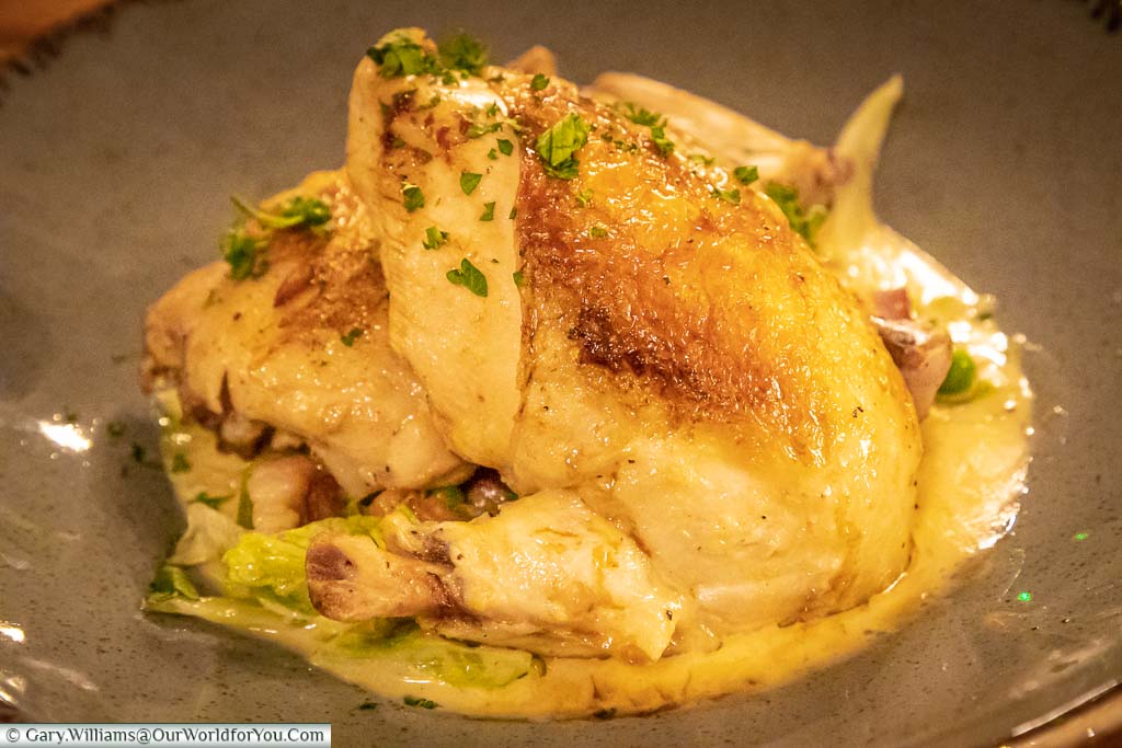 A golden herb-roasted chicken in the Dozen Restaurant at the White Horse hotel in Dorking