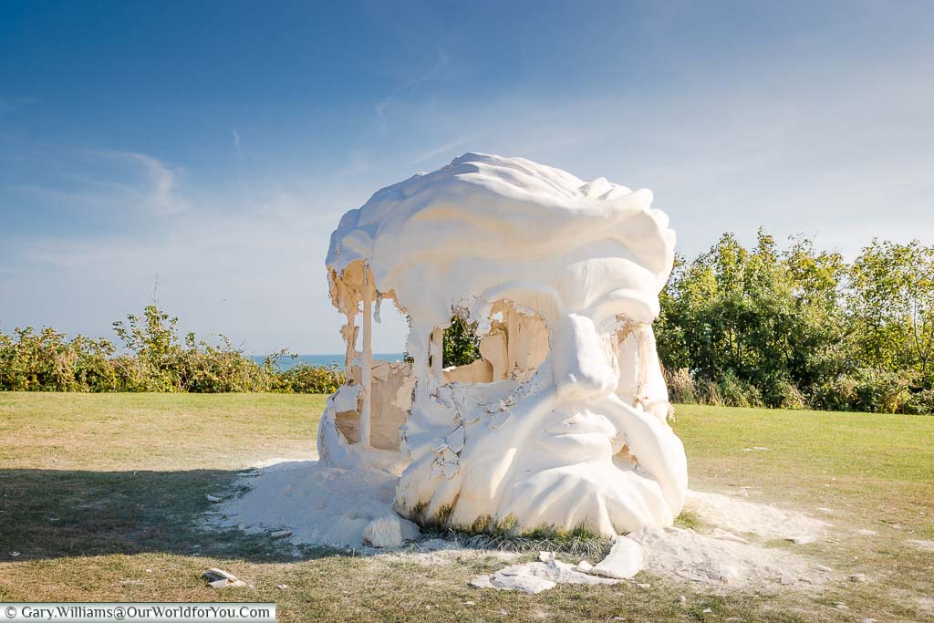 The vandalised double-headed chalk head of the Greek god title Janus Fortress: Folkestone on the clifftop