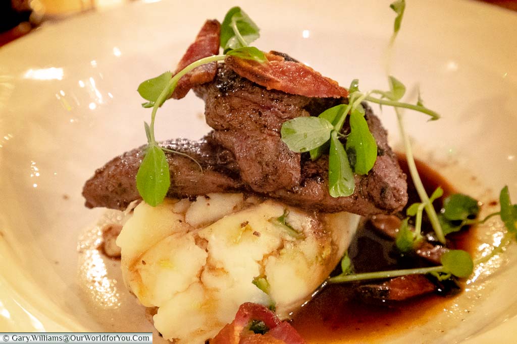 A traditional dish of liver and bacon, on a bed of mashed potato, in the Dozen Restaurant at the White Horse Hotel in Dorking