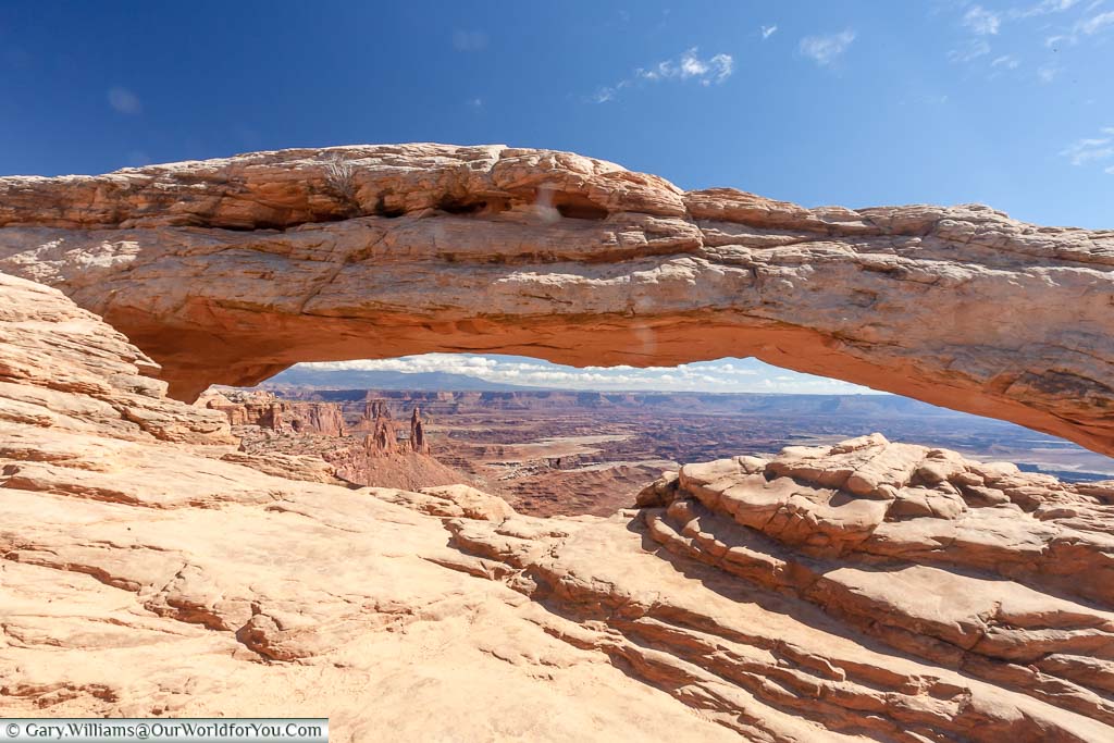 The view through then natural sandstone Mesa Arch in the Canyonlands National Park, Utah, USA