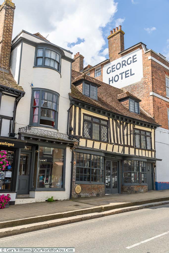 Historic shops squeezed into gaps on Battle High Street, East Sussex