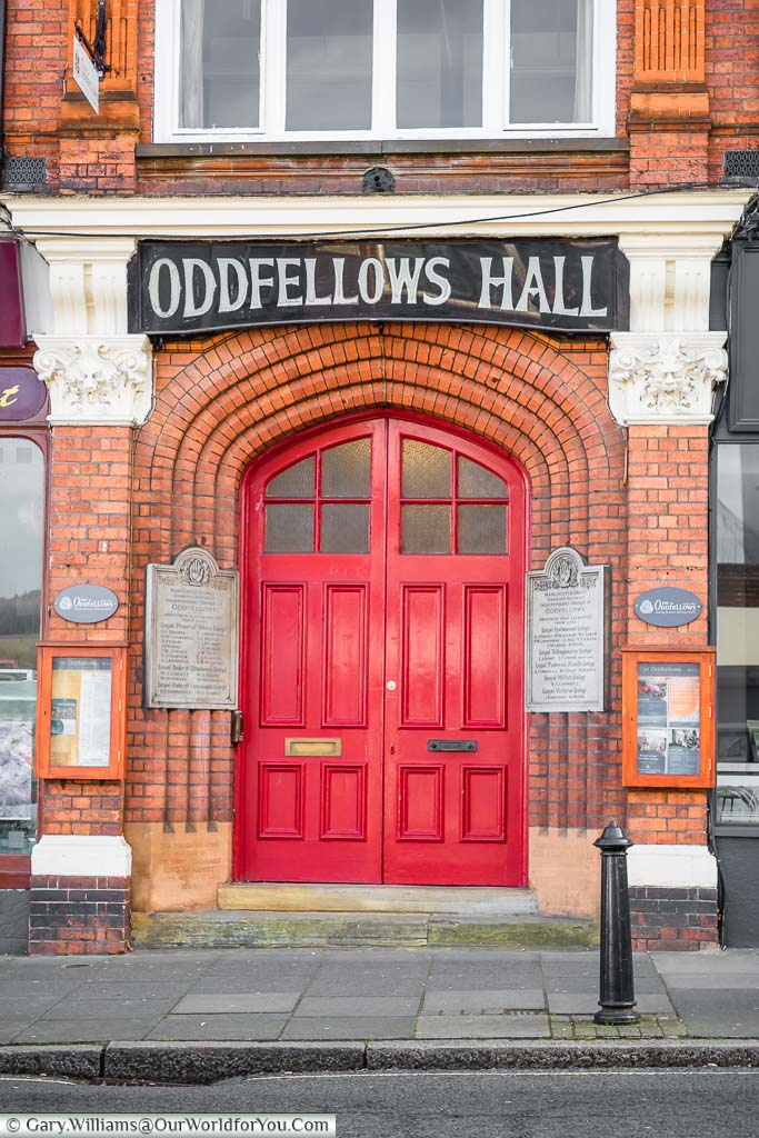 The bright red doors to the Oddfellows Hall on Dorking High Street