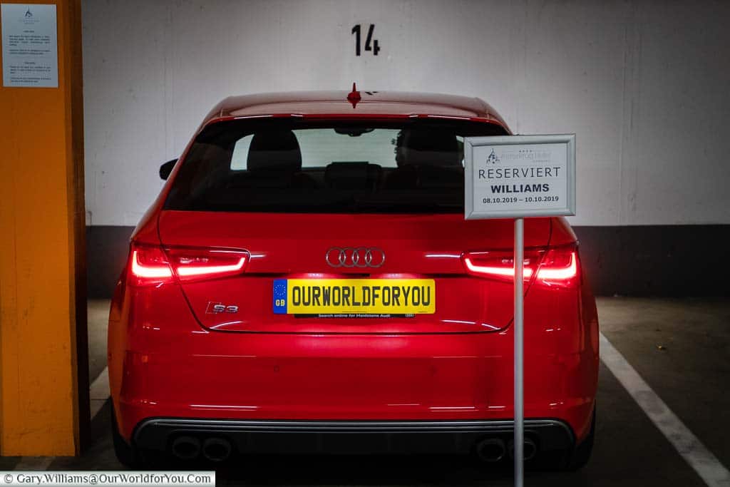 Our red Audi S3 parked in a reserved space at the underground car park of our Hamburg hotel