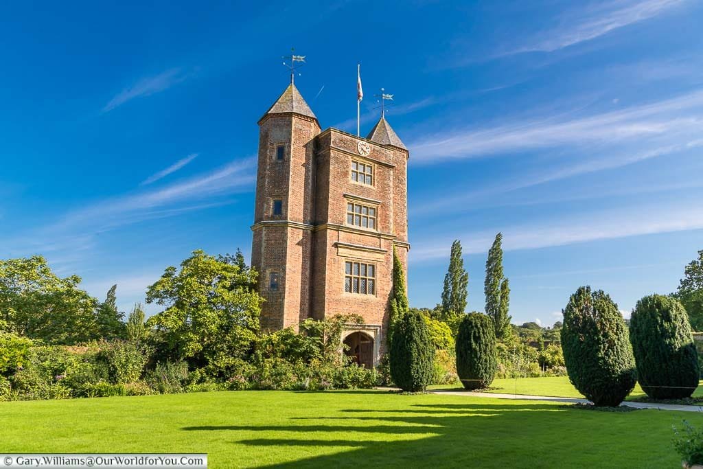 The green lawn in front of the Sissinghurst Castle’s turreted tower at Sissinghurst Castle Garden