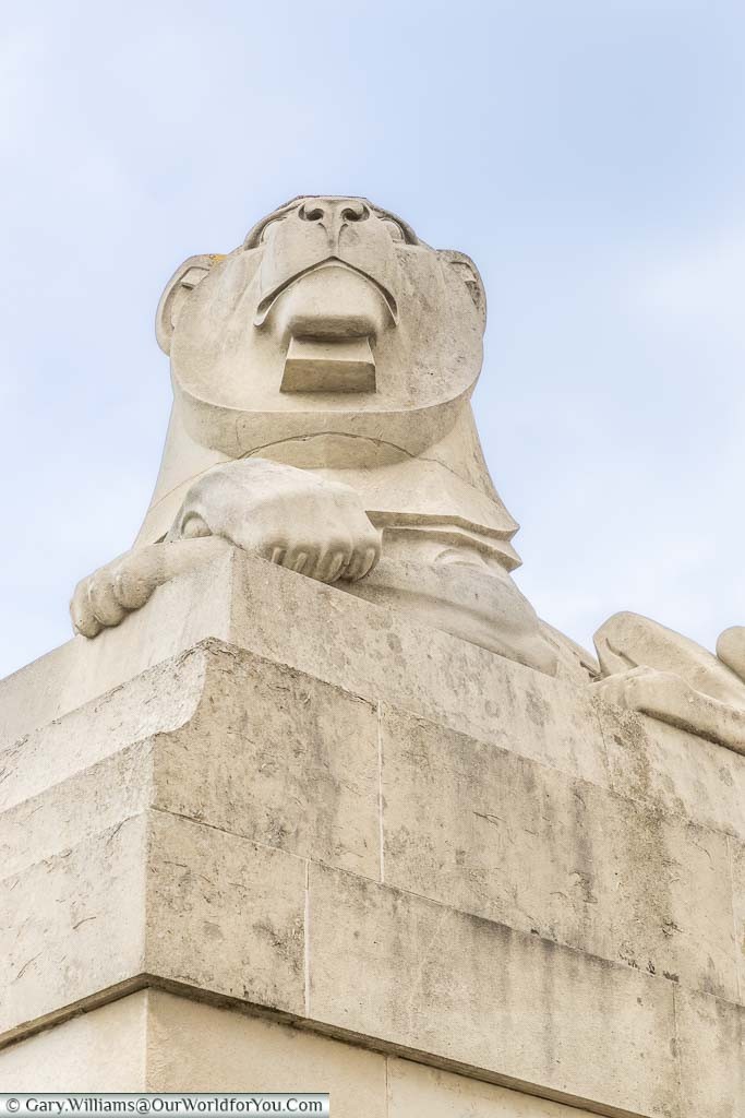 One of four Art Deco styled lions that sit at the four corners of the Obelisk in the Chatham Naval Memorial in Kent