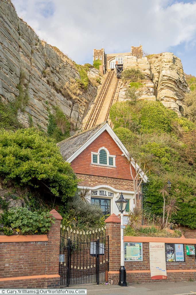 The stone waiting room at the bottom of the East Hill funicular railway, with the tracks leading up to the station on top of Hasting's cliffs