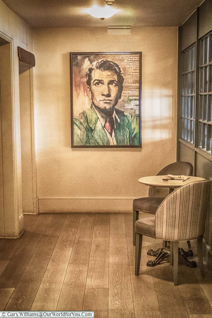 A portrait of Laurence Olivier at the end of a corridor in the White Horse Hotel, Dorking