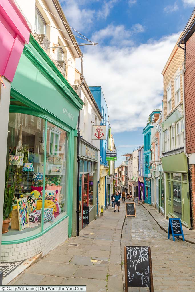 The Old High Street in Folkestone lined with brightly coloured, quirky shops and boutiques.