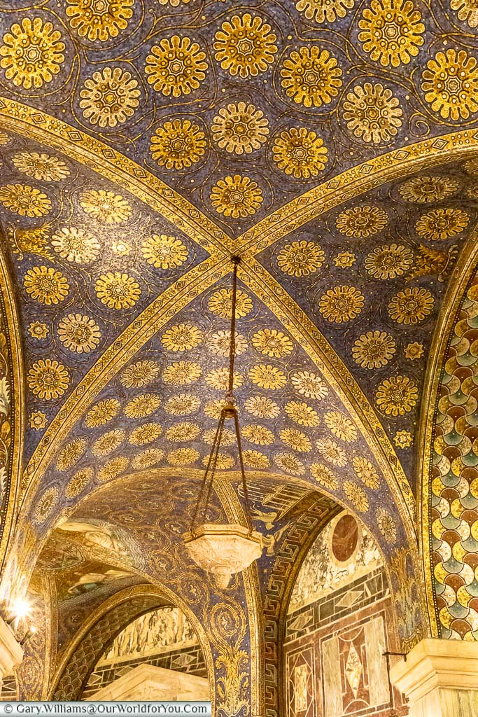 The blue and gold vaulted arches of the Dom are constructed of tiny bits of tile in a mosaic style.
