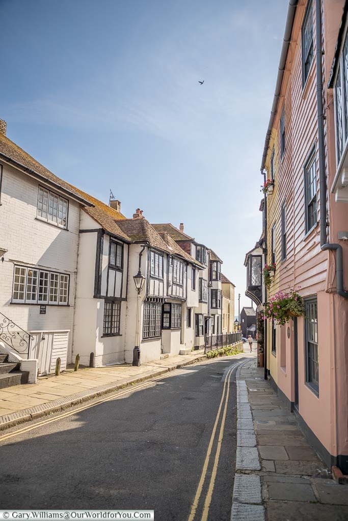 Brightly coloured weatherboarded homes at the end of All Saints’ Street in Hastings