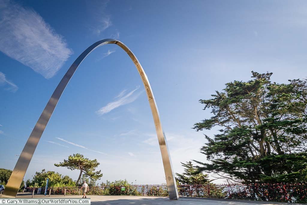 Step Short Memorial. Commemorative steel arch honouring WWI soldiers in an urban green space in Folkestone with English Channel views