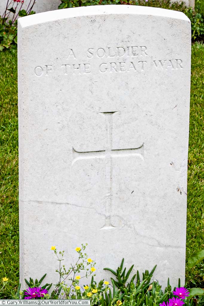 A headstone to an unknown soldier bearing the inscription 'A Soldier of the Great War'