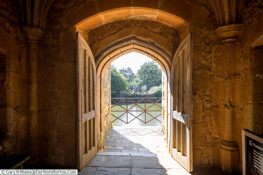 A stone doorway at the southern end of Bodiam Castle next to the Postern Tower looking out to the moat
