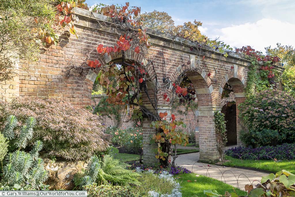A brick-built triple arch within the Rose Garden at Hever Castle