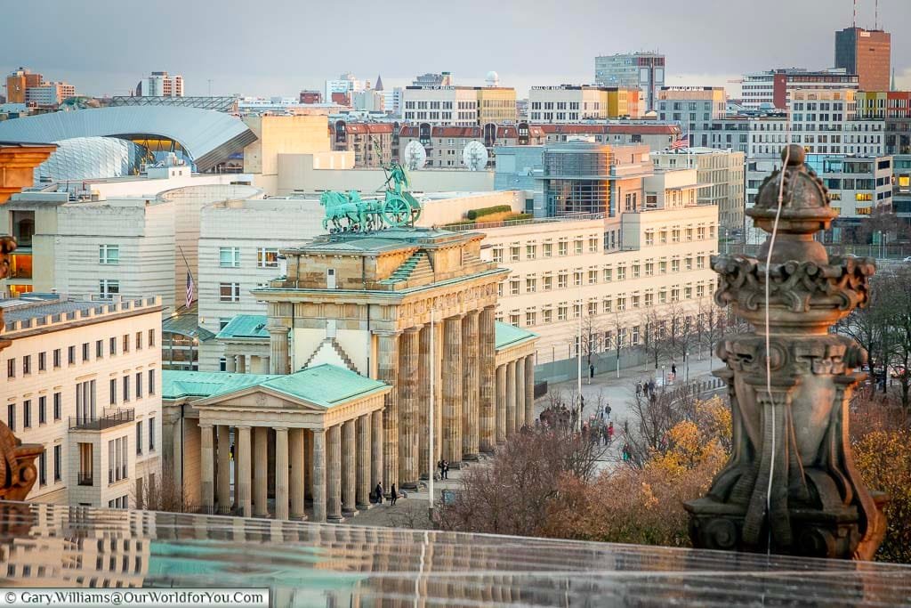 A view of the Brandenburg gate from the rooftop of the Reichstag, with the American embassy in the background.