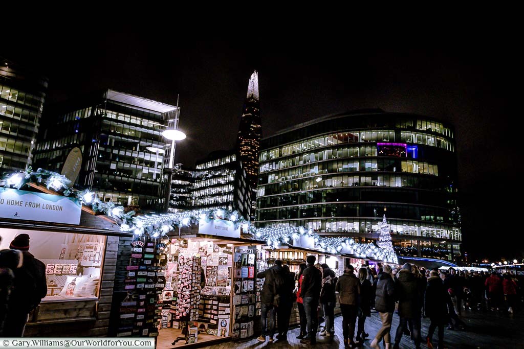 Stalls of Christmas by the River Market with the Shard in the background