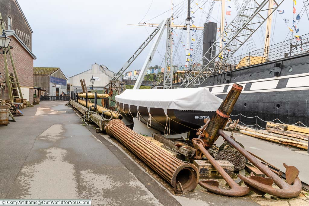 The dockside of the Great Western Dockyard carefully littered with heavy accessories, next the SS Great Britain