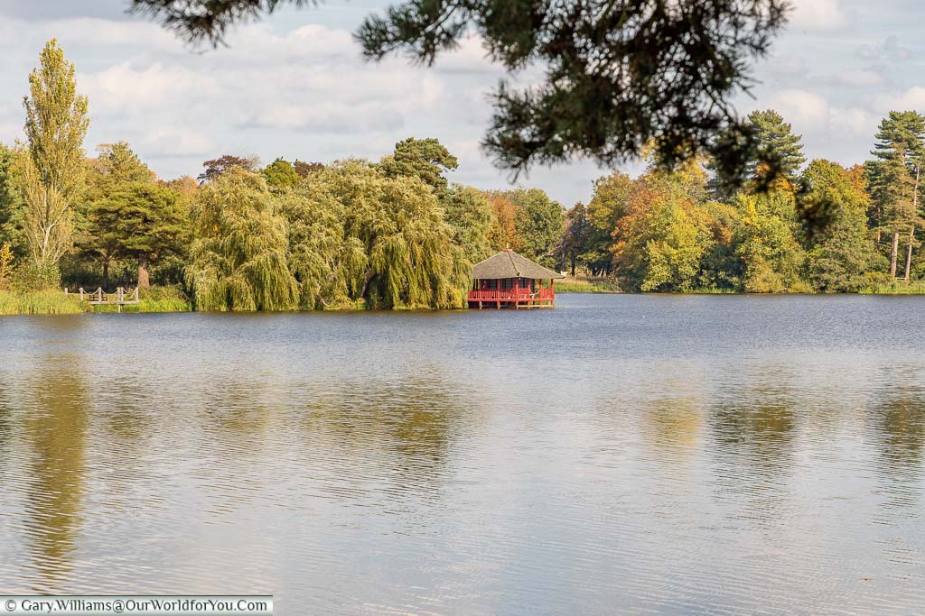 A view across Hever Castle's lake to the Japanese Tea house on the far side.