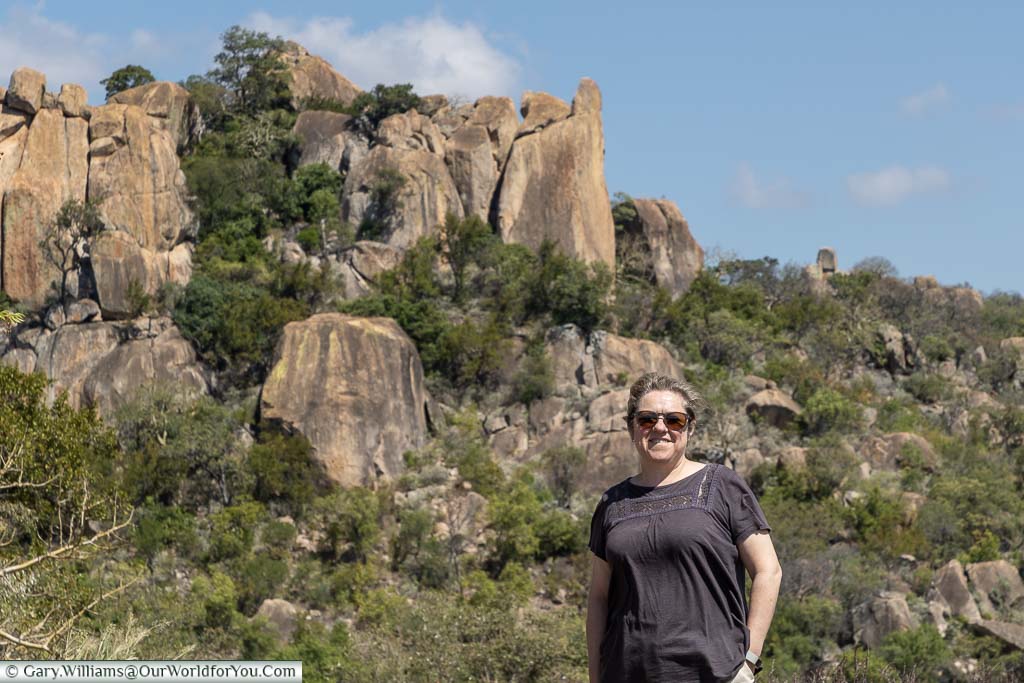 A shot of Janis with a rock formation in the background at Matobo National Park.