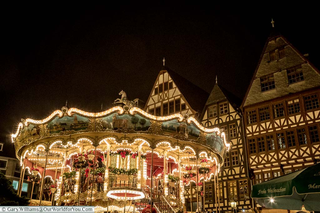 The brightly lit carousel in Frankfurt's Römerberg Christmas market