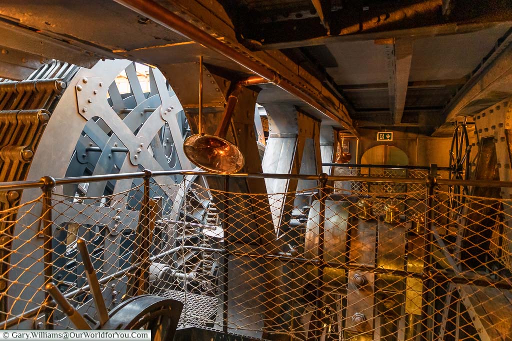 The huge mechanicals of the powertrain inside the engine room of the SS Great Britain.