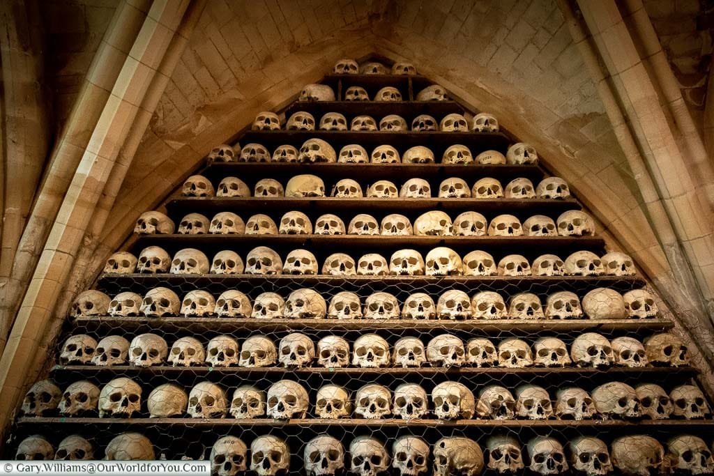 Skulls stacked on shelves at the ossuary at St. Leonard’s Church and Crypt in Hythe