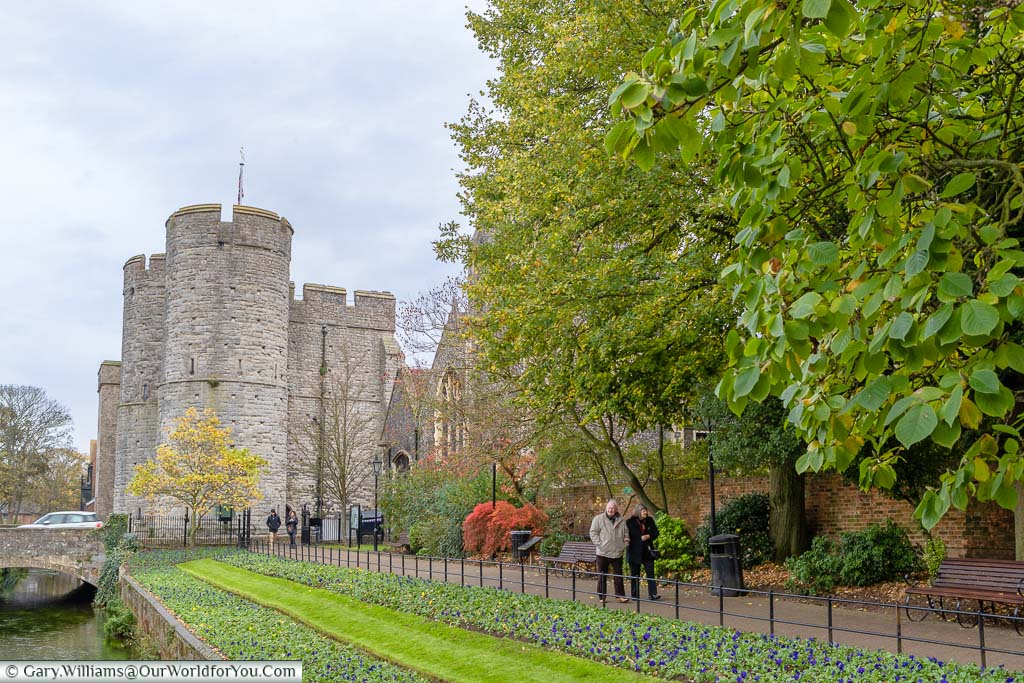 An autumnal scene of the River walkway in Canterbury in front of the Westgate towers.