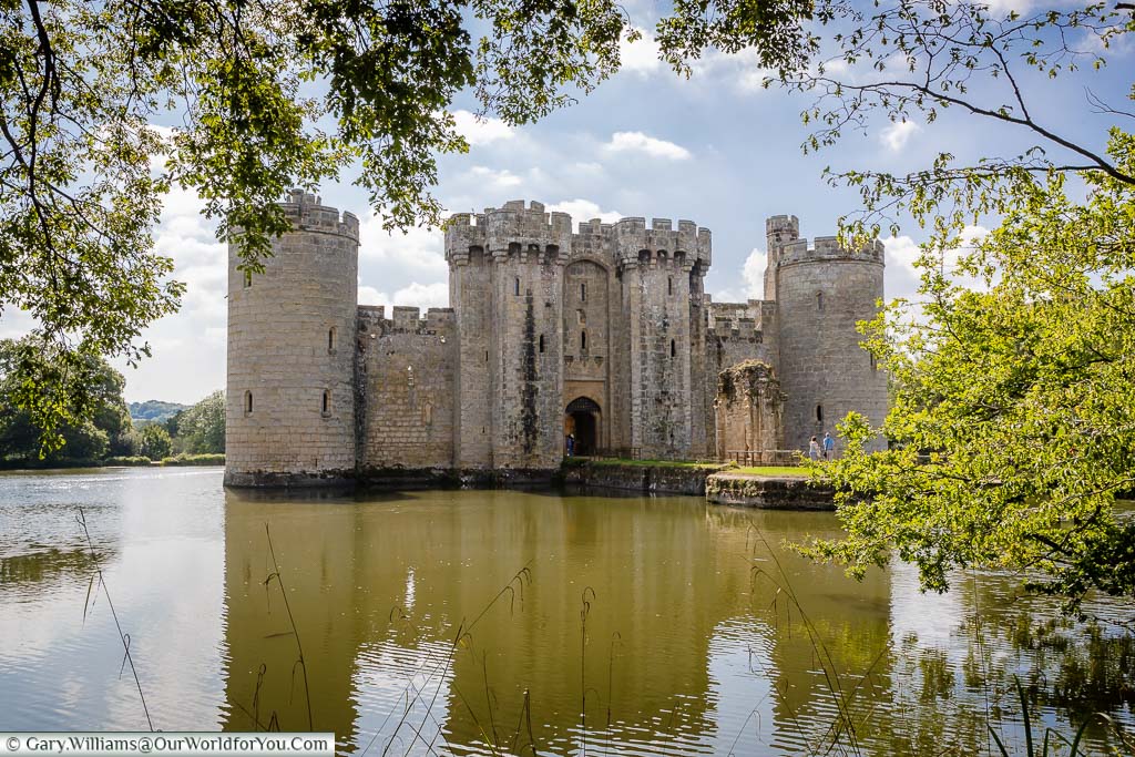 The north view of the entrance to Bodiam Castle reflected in the moat that surrounds it