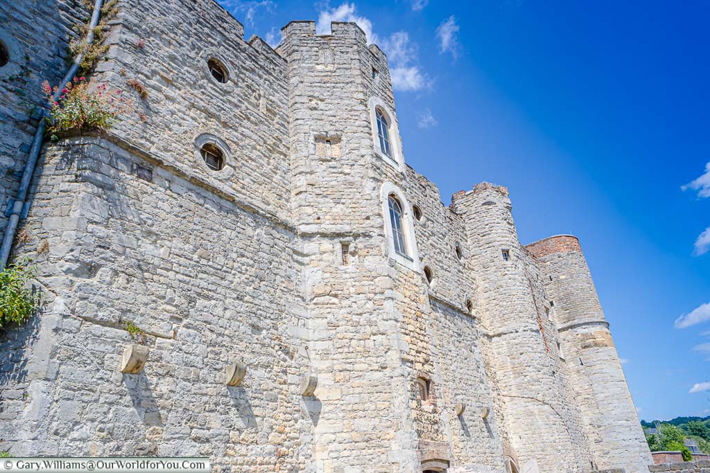 Looking up at the stone river-facing facade of Upnor Castle on the River Medway in Kent
