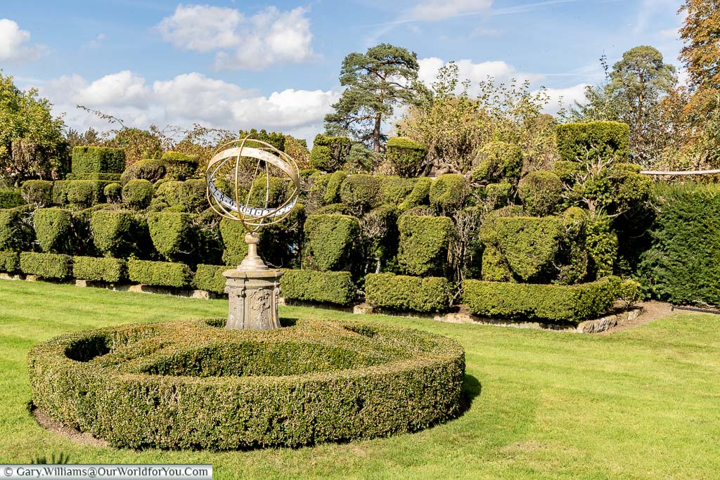 The astrolabe feature in front of the topiary chess set in the Tudor garden at Hever Castle
