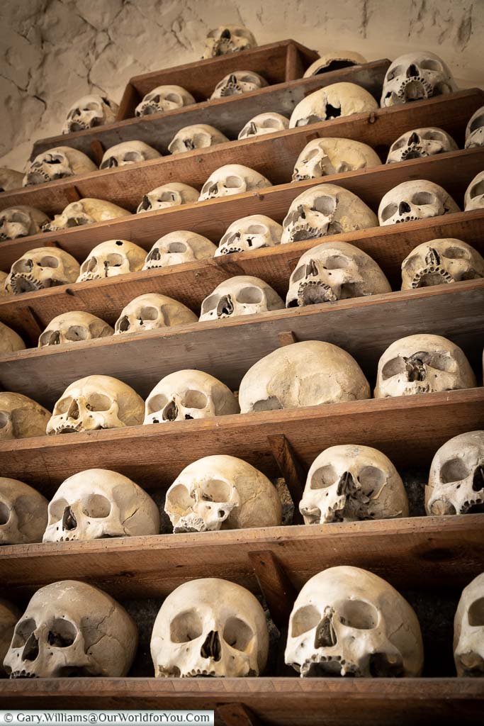 A tower of skulls on shelves at the ossuary at St. Leonard’s Church and Crypt in Hythe
