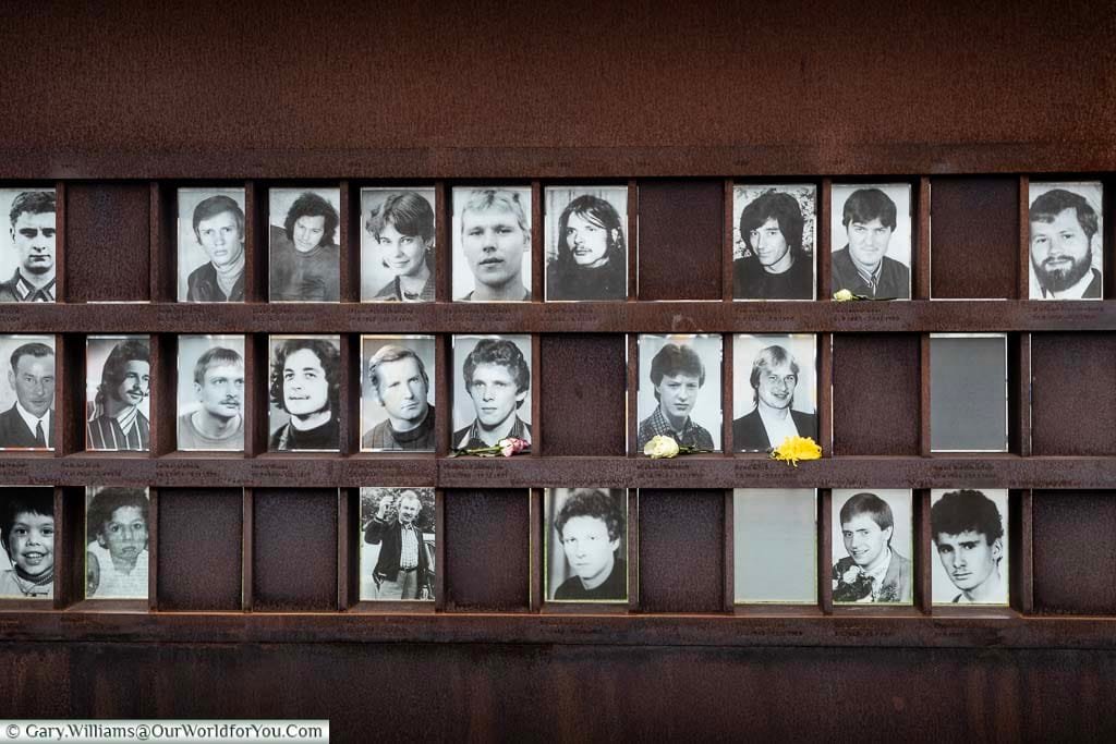 A Memorial Wall constructed of rusted iron with a place for each individual of the killed trying to cross the Berlin Wall, the majority with a portrait of the fallen.