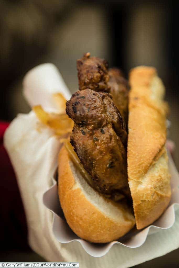 A heavily seasoned grilled pork fillet served in a bread roll on the German Christmas Markets in Cologne.