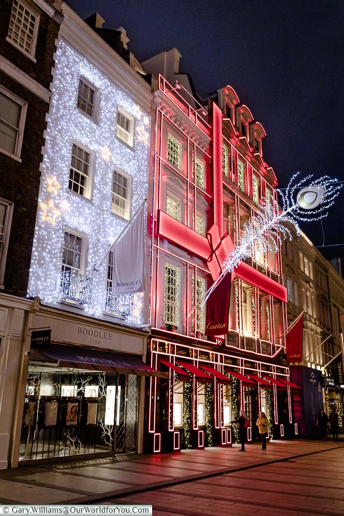 Two beautifully decorated stores, ready for Christmas, in London’s New Bond Street early in the evening