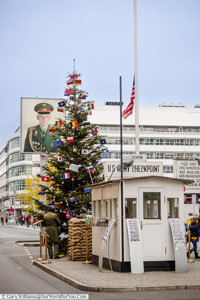The white wooden hut of the US Army at Checkpoint Charlie in Berlin at Christmas